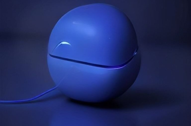 Modern wireless earbuds resting on a dark surface with subtle glowing soundwave patterns representing smart noise-cancelling technology.